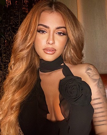 Malu Trevejo Looks Stunning in Black Dress, Flaunting Her Gorgeous Curves