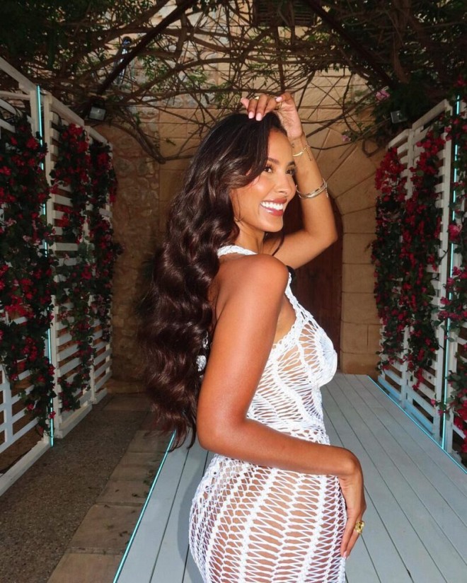Maya Jama’s Seductive Photo Shoot: Braless in White, Teasing with Her Curves