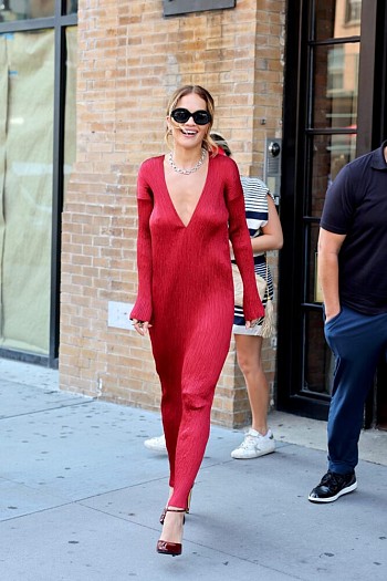 Rita Ora’s Bold Fashion: Red Dress & Alluring Braless Look