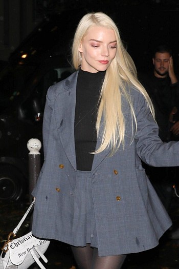 Anya Taylor-Joy Flashes Braless Look in Sheer Top and Stockings at Paris Party